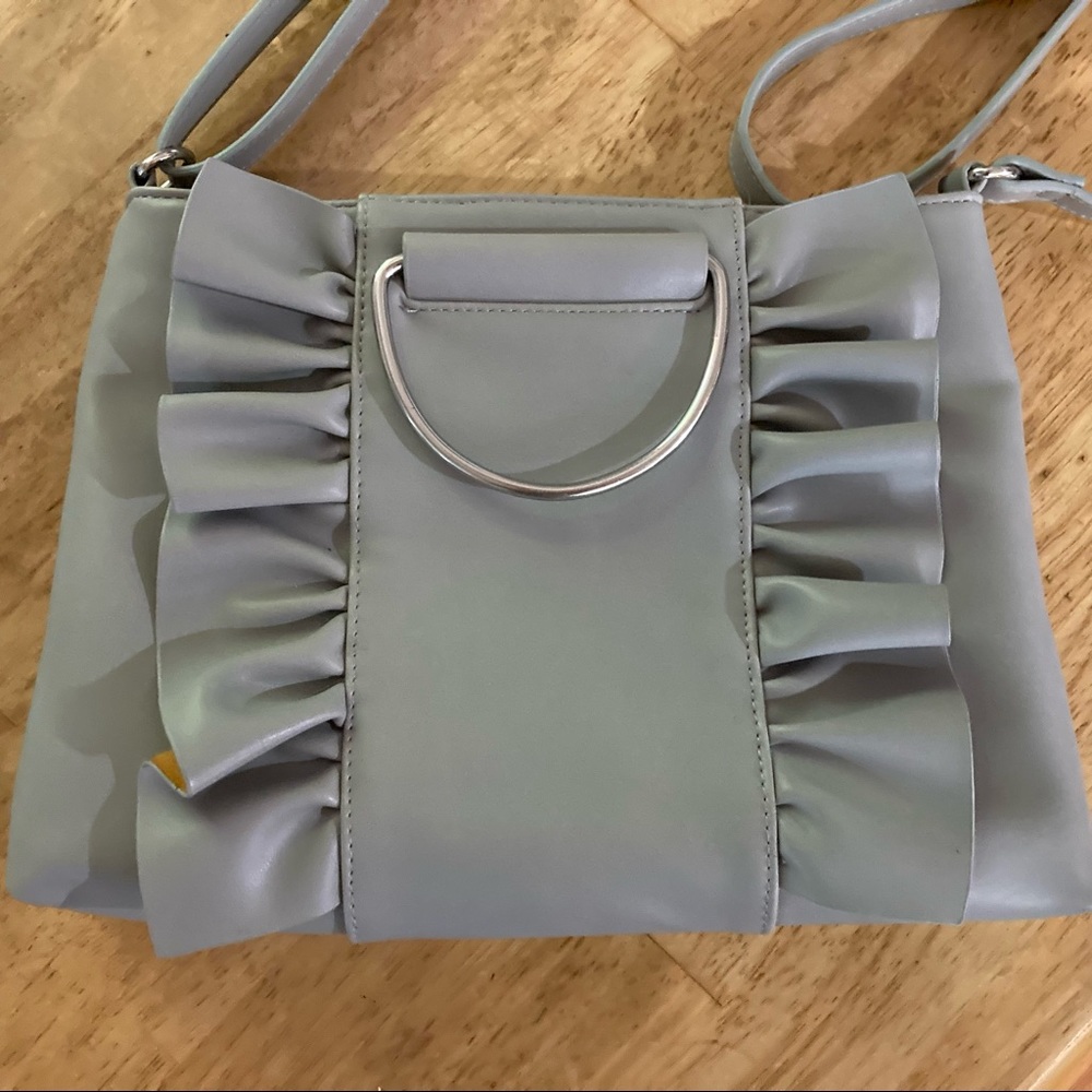 Ruffly grey sling purse with 3 inside pockets and adjustable strap